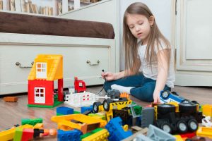 girl playing with STEM toys